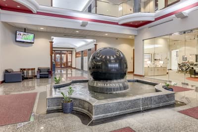 Marble ball fountain in the Millennium Plaza lobby with granite flooring