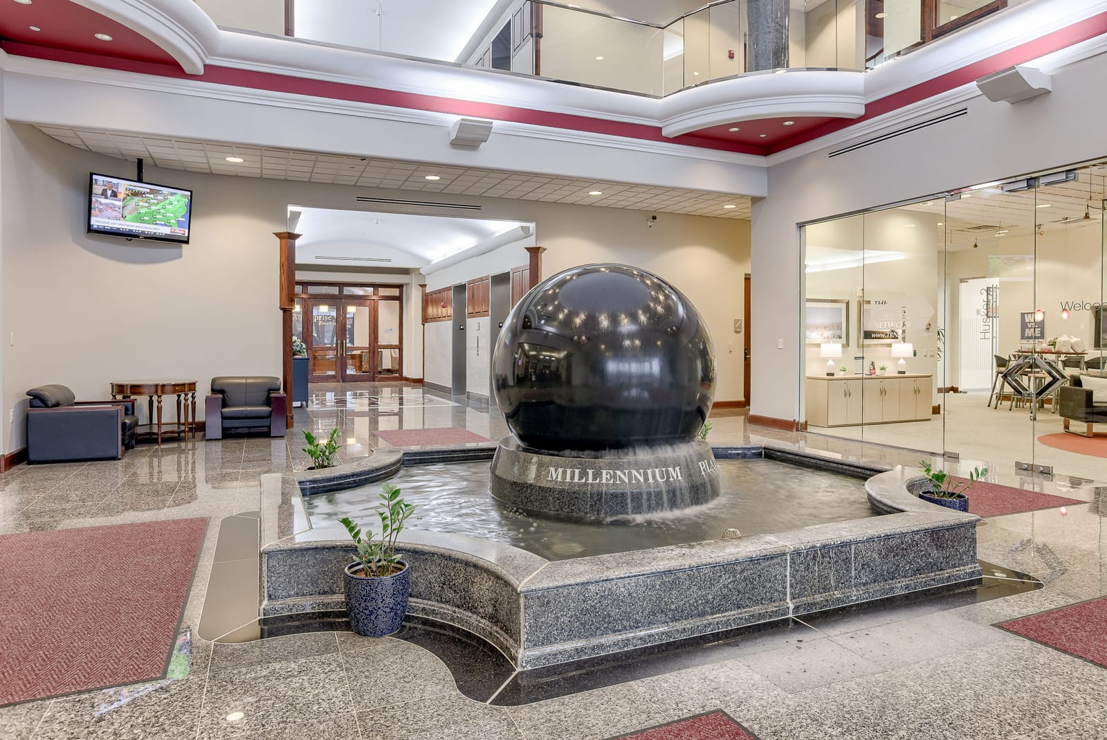 Millennium Plaza lobby with marble ball fountain in West Omaha